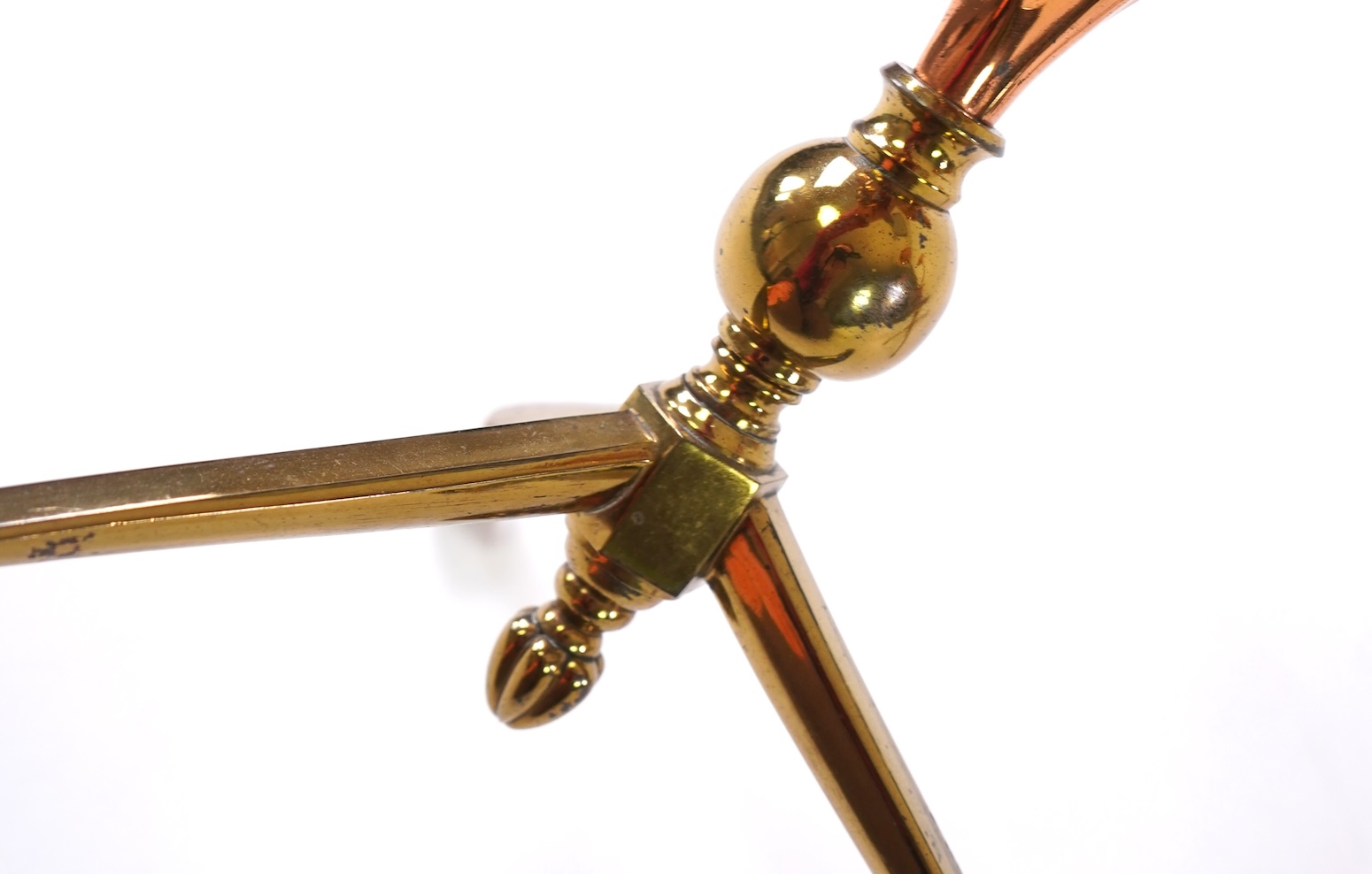 W.A.S. Benson & Co.: A pair of Arts and Crafts gilt brass and copper three branch candelabra
